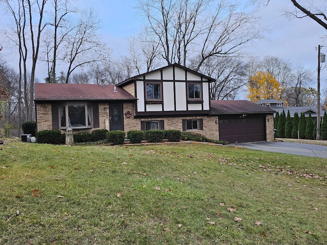 view of front of property featuring a garage and a front lawn