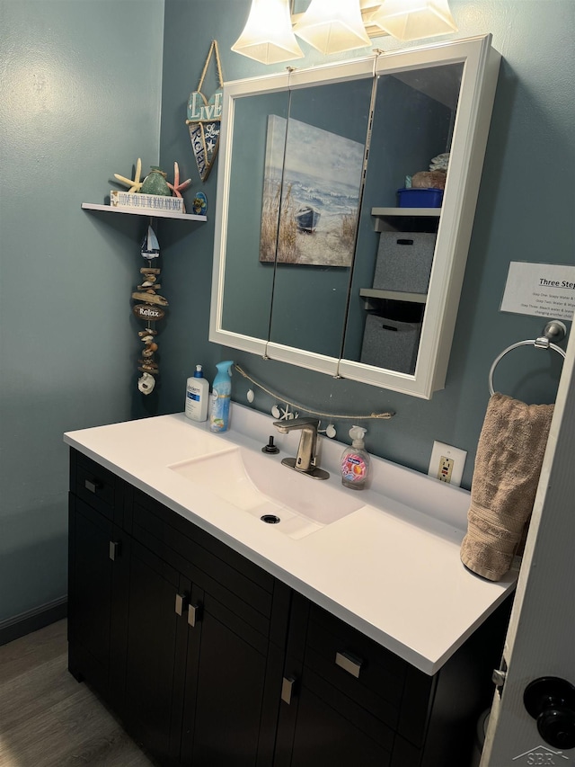 518 W Belle Ave, Saint Charles, MI 48655 - bathroom with vanity and wood finished floors