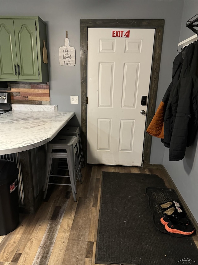 518 W Belle Ave, Saint Charles, MI 48655 - laundry area featuring wood finished floors