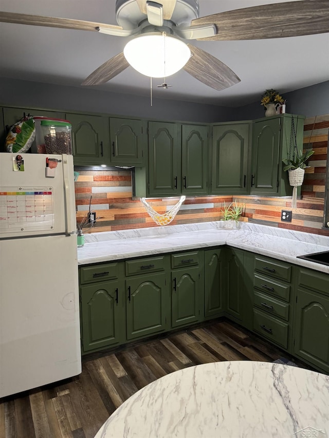 518 W Belle Ave, Saint Charles, MI 48655 - kitchen with green cabinets, freestanding refrigerator, dark wood-style flooring, and ceiling fan
