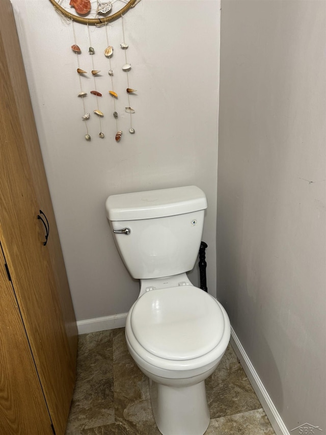 518 W Belle Ave, Saint Charles, MI 48655 - bathroom with toilet and baseboards