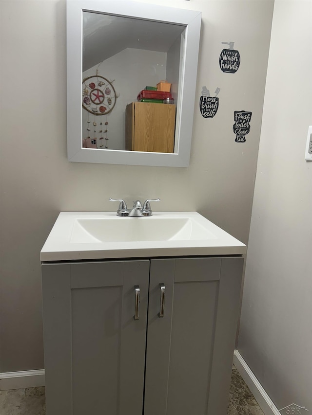 518 W Belle Ave, Saint Charles, MI 48655 - bathroom featuring vanity and baseboards