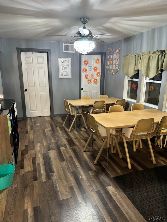 dining room with dark hardwood / wood-style flooring and ceiling fan