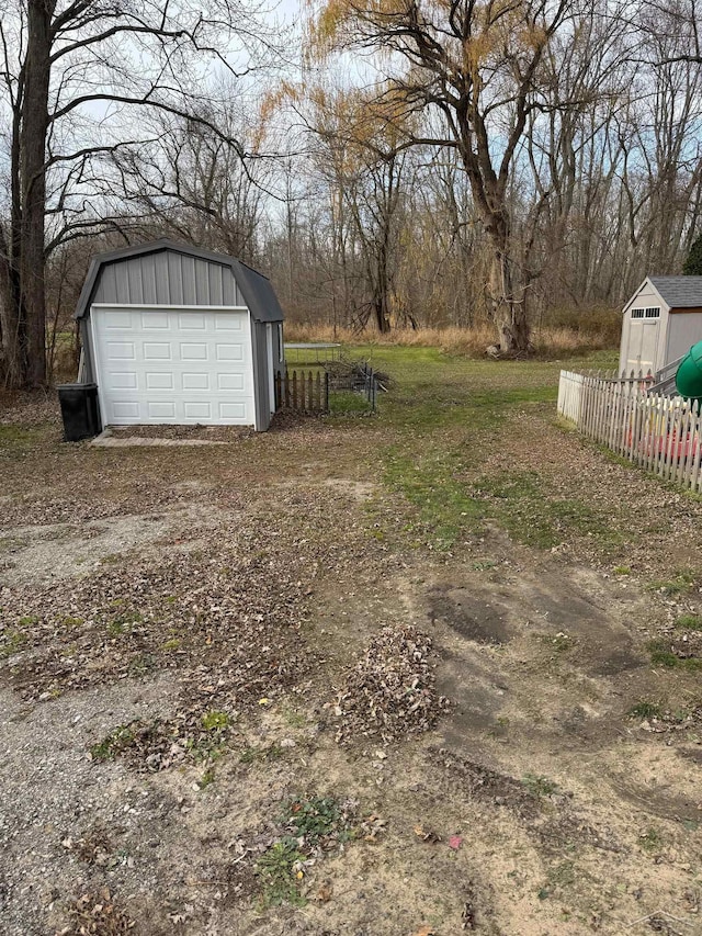 view of yard with an outbuilding and a garage