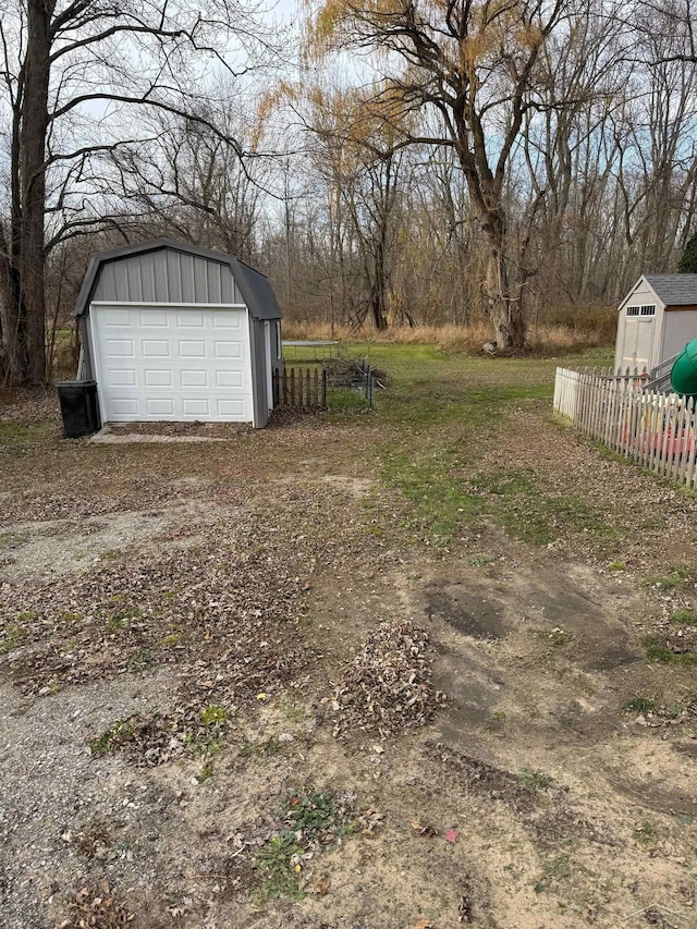518 W Belle Ave, Saint Charles, MI 48655 - view of yard featuring a garage