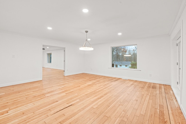 3897 Sand Rd, Port Austin, MI 48467 - unfurnished room with light wood-type flooring, crown molding, recessed lighting, and baseboards