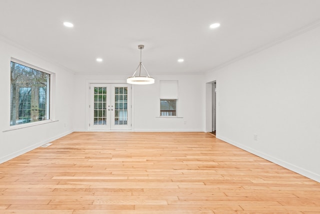 3897 Sand Rd, Port Austin, MI 48467 - spare room with crown molding, french doors, light wood-style flooring, recessed lighting, and baseboards