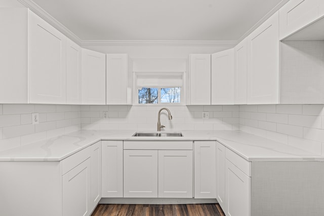 3897 Sand Rd, Port Austin, MI 48467 - kitchen with a sink, white cabinetry, and ornamental molding