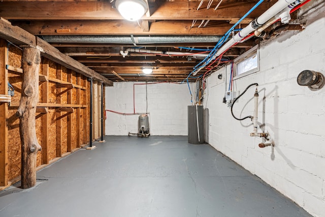 3897 Sand Rd, Port Austin, MI 48467 - below grade area featuring water heater and gas water heater