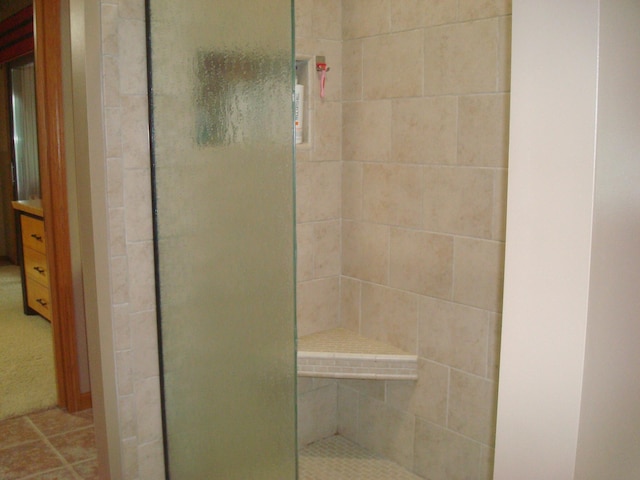 bathroom featuring tiled shower