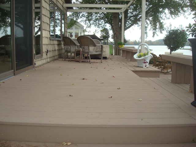 deck featuring a water view