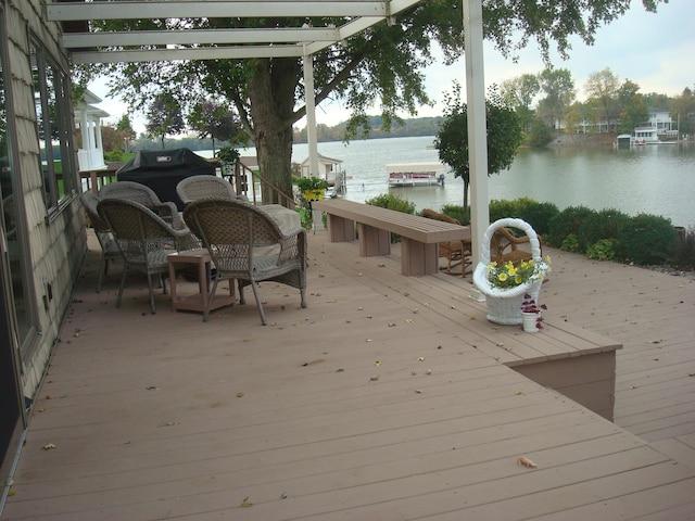 wooden deck with a water view