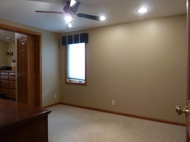 unfurnished bedroom with ceiling fan and carpet floors