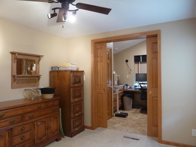 bedroom with light carpet, ceiling fan, and lofted ceiling