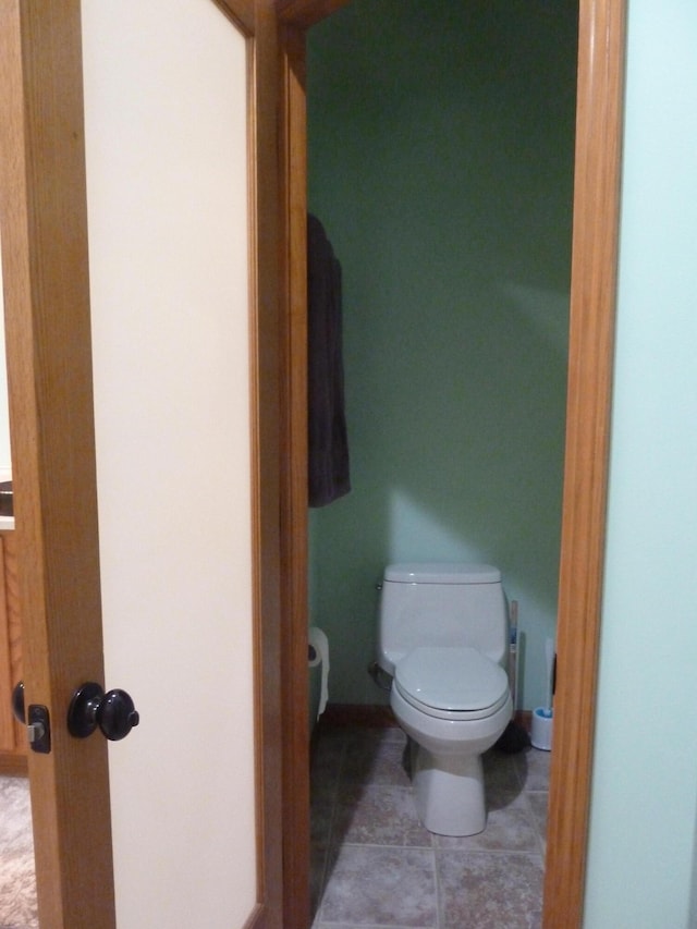 bathroom featuring tile patterned floors and toilet