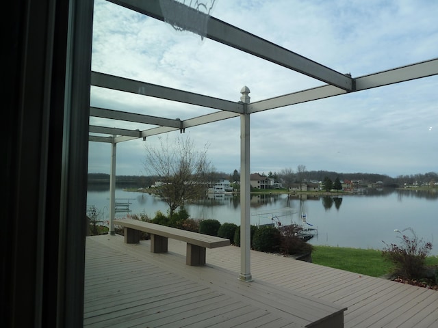 view of dock featuring a deck with water view