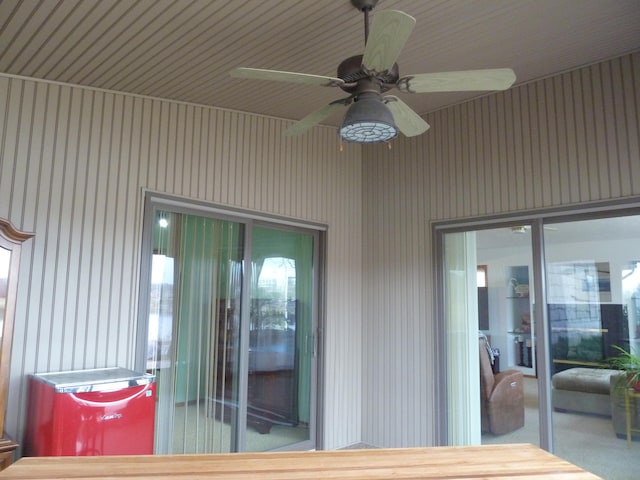 exterior space featuring ceiling fan