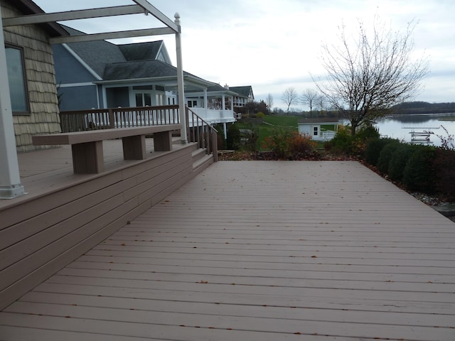 wooden deck with a water view