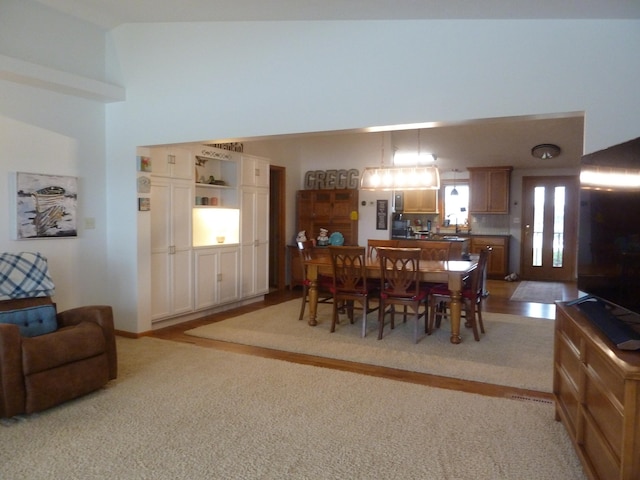 dining room featuring light colored carpet