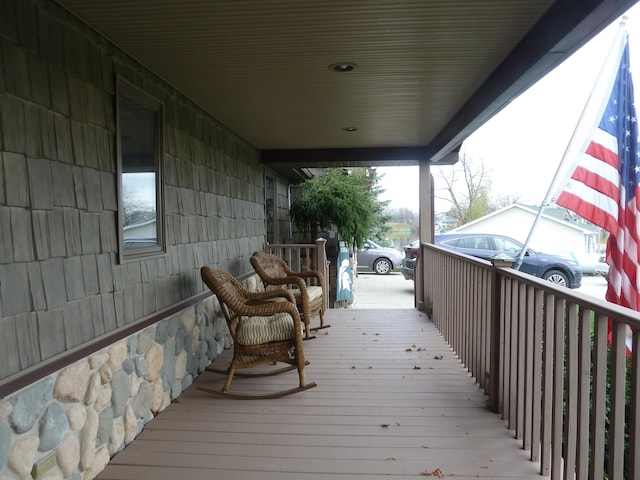 wooden deck featuring covered porch