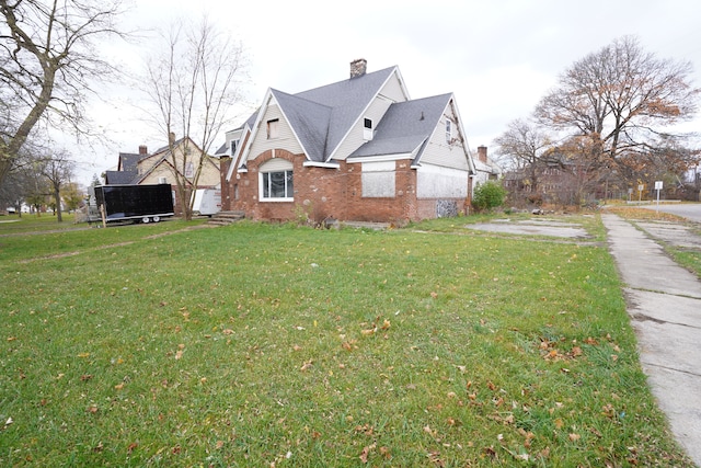 view of property exterior with a yard