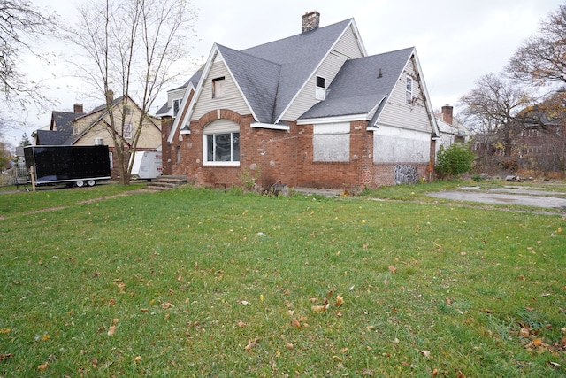 view of property exterior with a yard