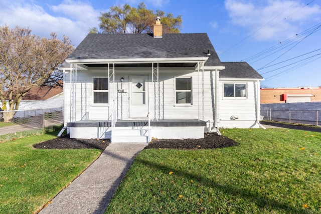 7641 Westminster Ave, Warren, MI 48091 - bungalow-style house with covered porch, a chimney, and roof with shingles