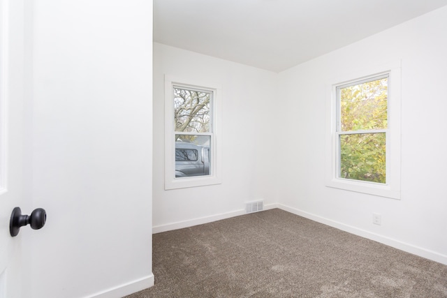 unfurnished room with carpet flooring