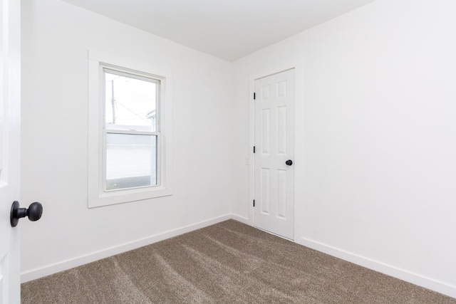 7641 Westminster Ave, Warren, MI 48091 - spare room with dark carpet and baseboards