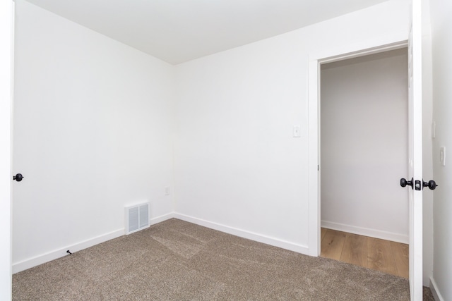 spare room featuring carpet flooring