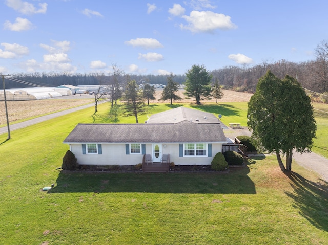 exterior space featuring a rural view and a front yard