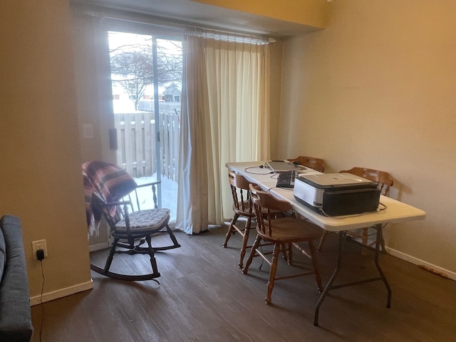 home office with dark hardwood / wood-style floors