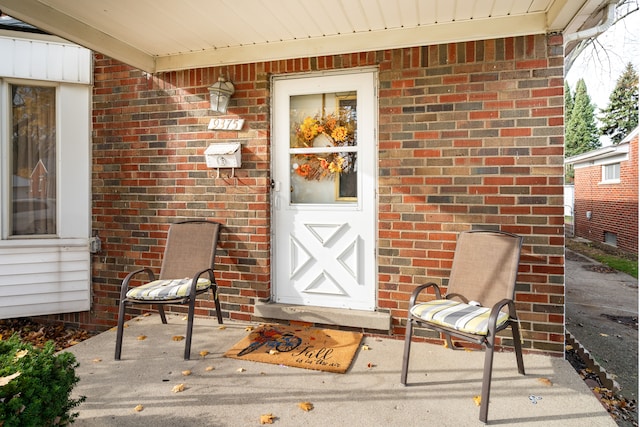 doorway to property with a patio area