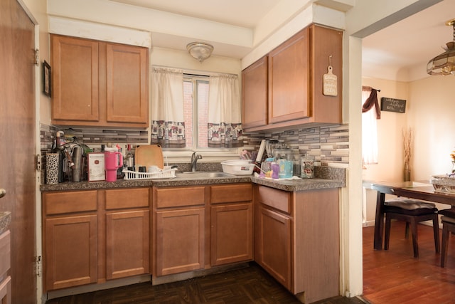 kitchen featuring backsplash and sink