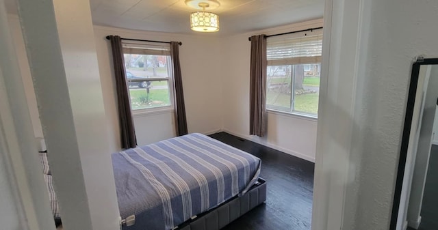 bedroom featuring dark wood-type flooring