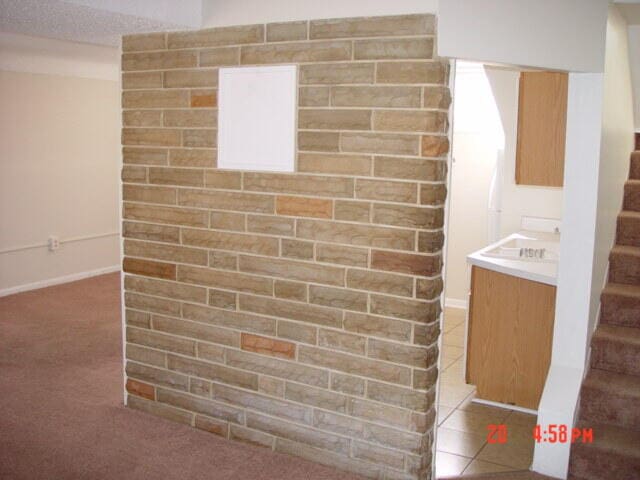 bathroom with tile patterned floors