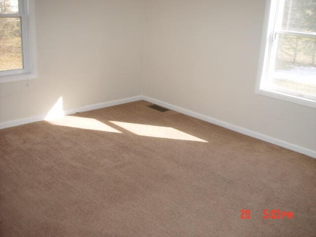 view of carpeted spare room