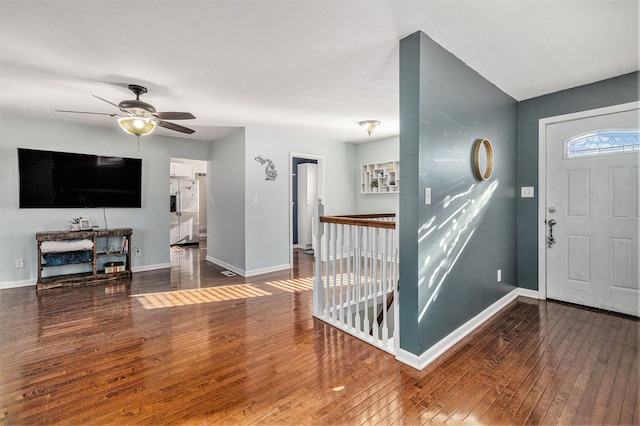 foyer entrance featuring ceiling fan and wood-type flooring