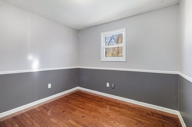 spare room with hardwood / wood-style floors