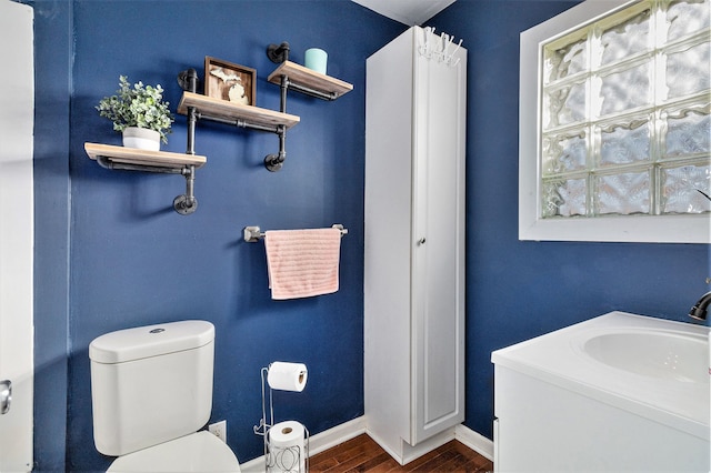 bathroom with wood-type flooring and toilet