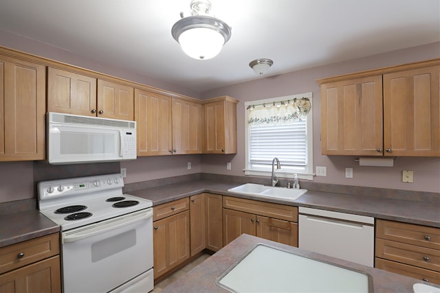 kitchen featuring white appliances and sink