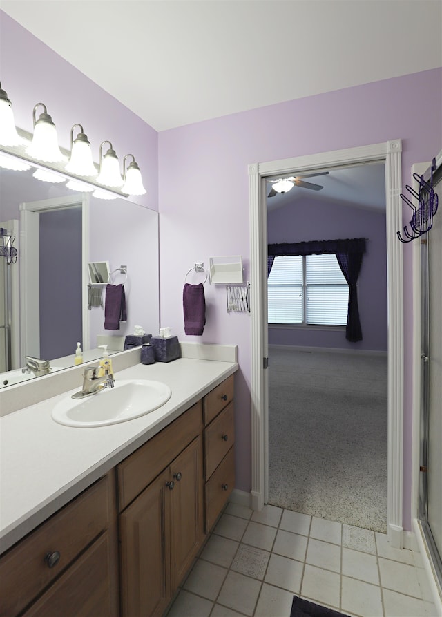 bathroom with tile patterned floors, ceiling fan, and vanity