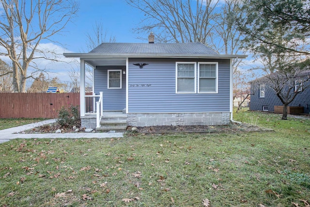 back of house with a yard