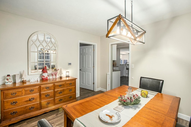 dining area with a healthy amount of sunlight and dark wood-type flooring