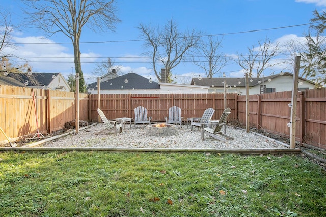 view of yard with an outdoor fire pit