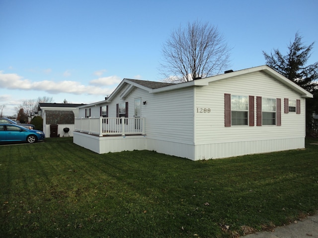 view of property exterior with a lawn