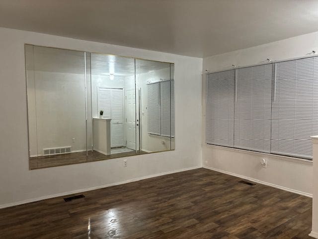 spare room featuring dark hardwood / wood-style floors