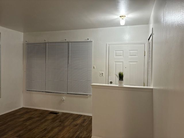 interior space featuring dark wood-type flooring