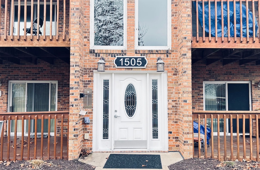 property entrance with a balcony