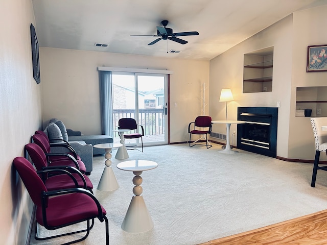 living room with carpet flooring and ceiling fan